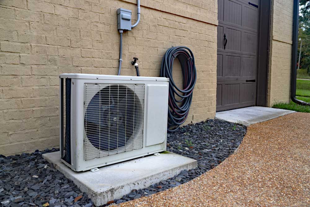Outdoor Ductless Mini Split Unit Near a Home